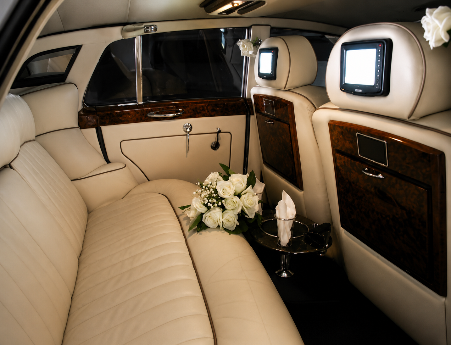 1956 white vintage Bentley sedan interior with cream leather seating