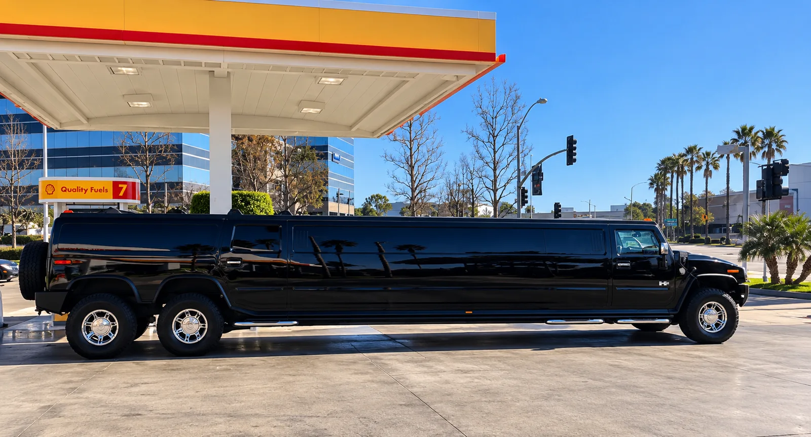 Black dual-axle Hummer limousine in daylight