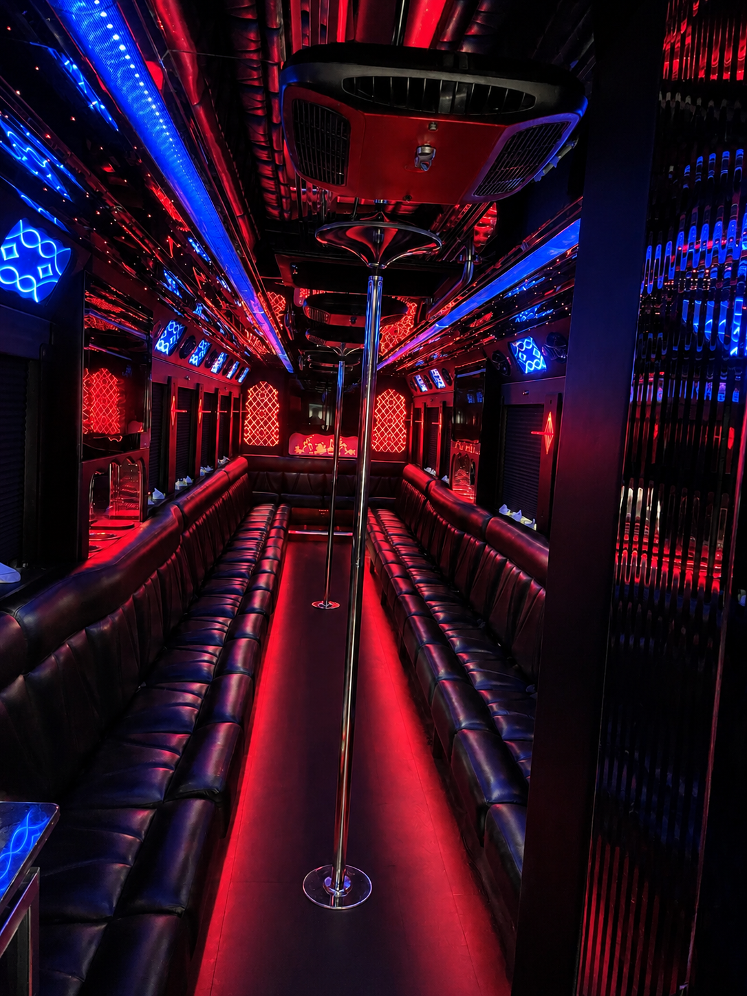 40 to 44 passenger luxury party bus interior with red and blue club lighting