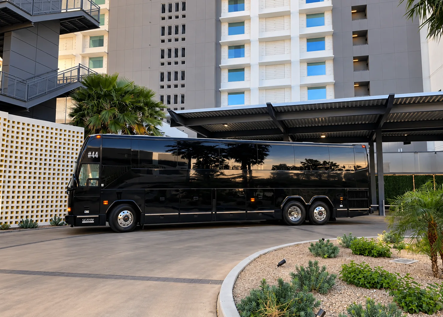 Black luxury coach outside a hotel
