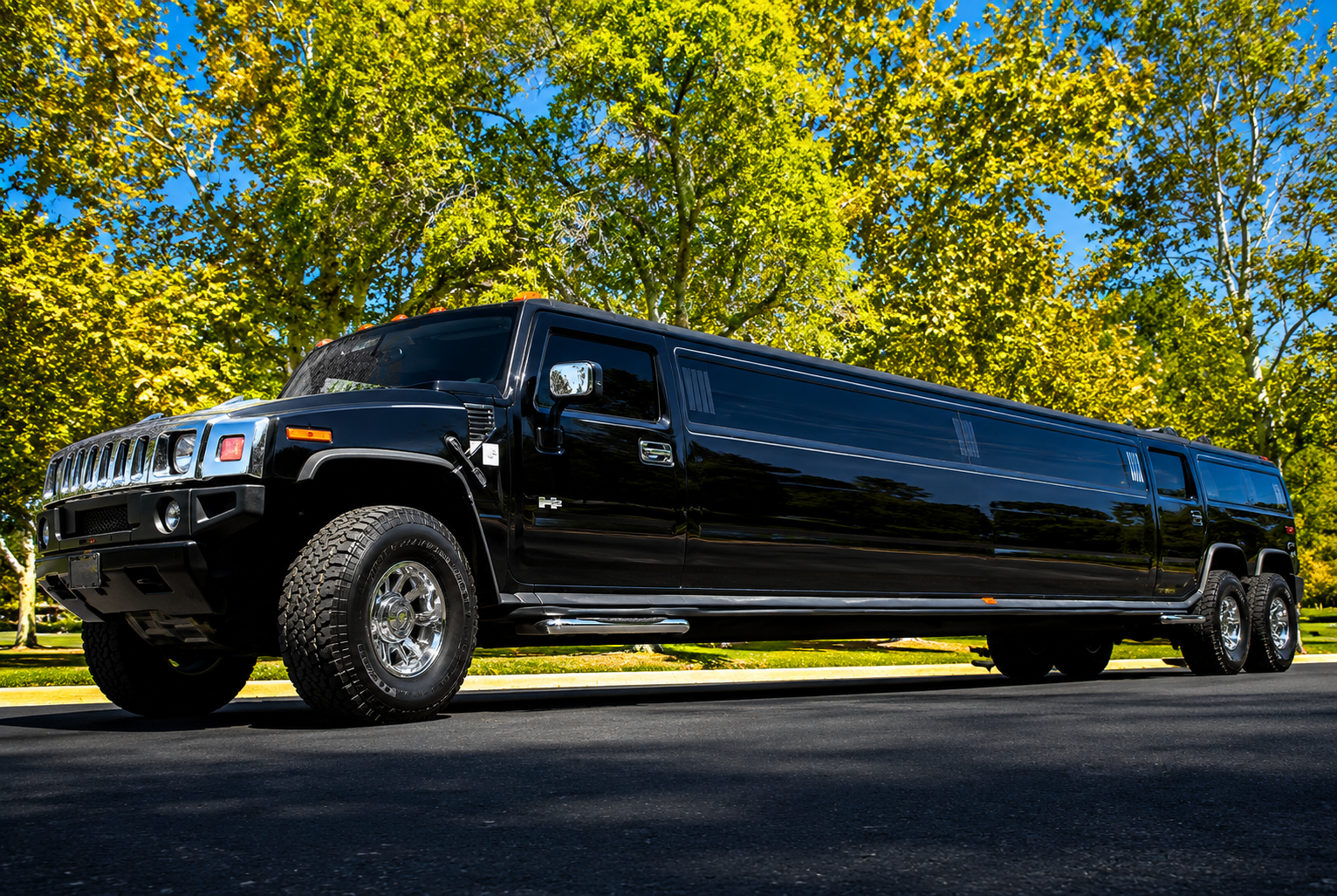 Dual axle black H2 Hummer limousine exterior